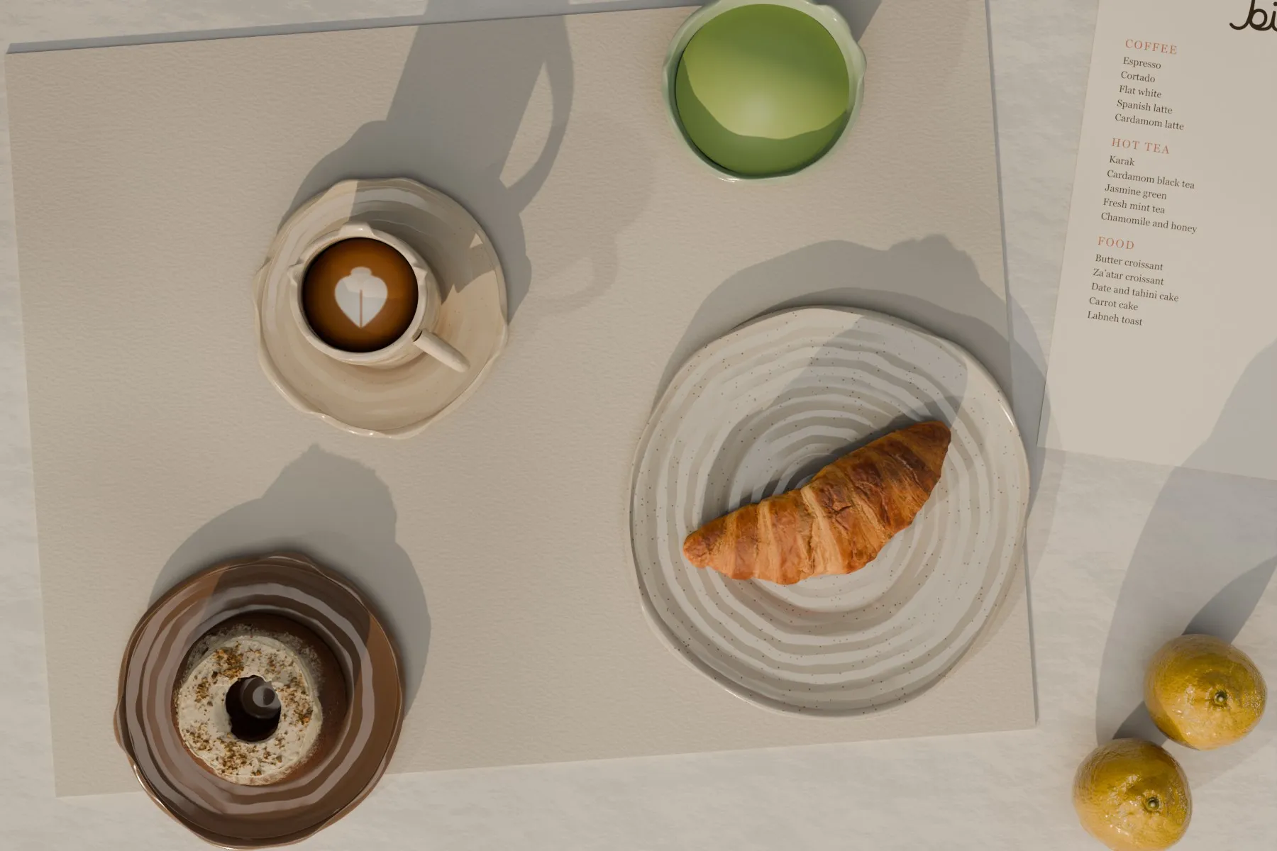 From above: a cappuccino, a croissant, matcha, carrot cake and the menu
