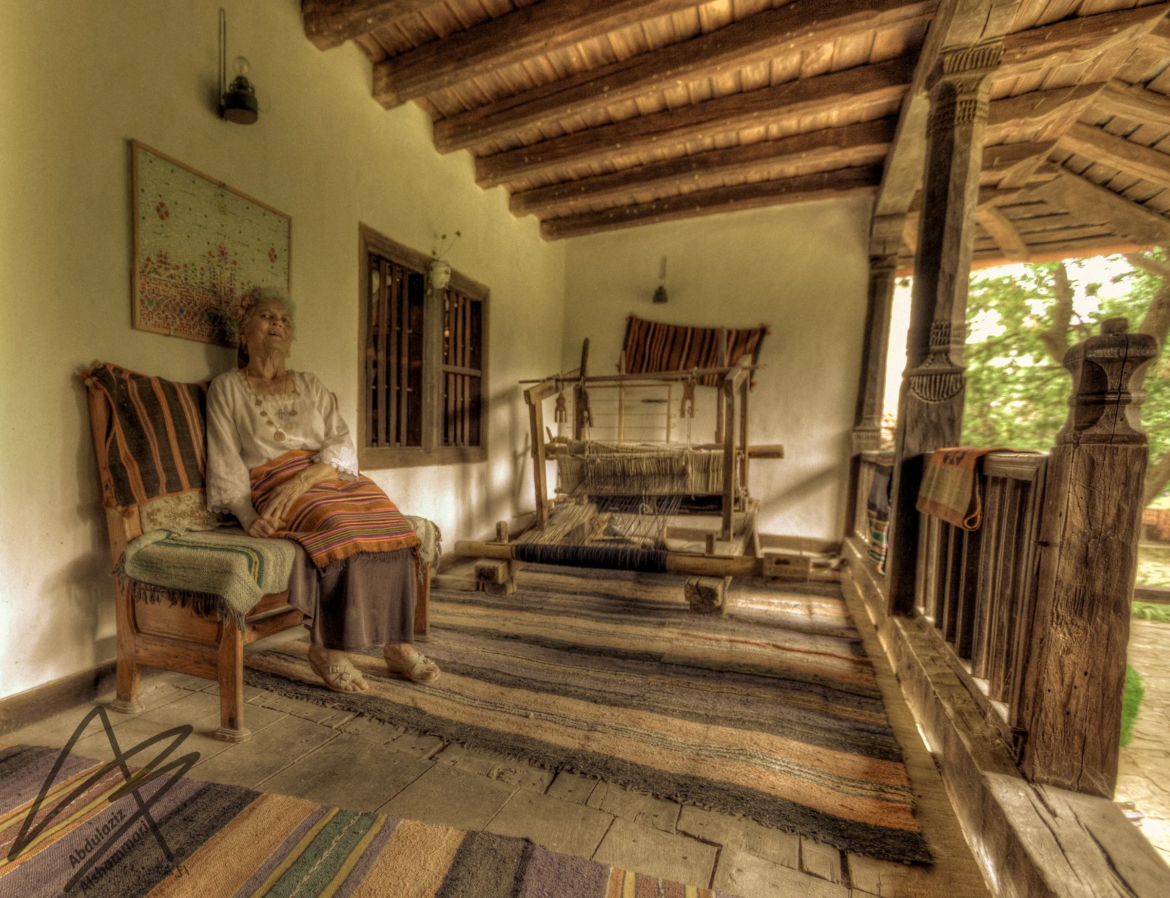A weaver's porch with loom, village museum